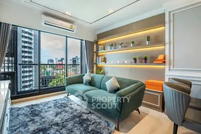 Modern living room with city view, stylish furniture, and elegant decor.