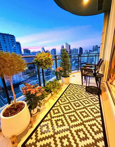 Stunning balcony with city skyline view, perfect for relaxing evenings.