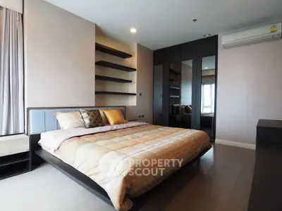 Spacious modern bedroom with elegant decor and ample storage space