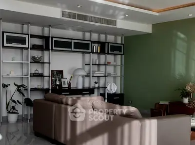 Modern living room with stylish shelving and comfortable seating