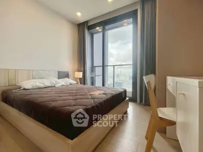 Modern bedroom with city view and stylish furniture, featuring a cozy bed and large window.