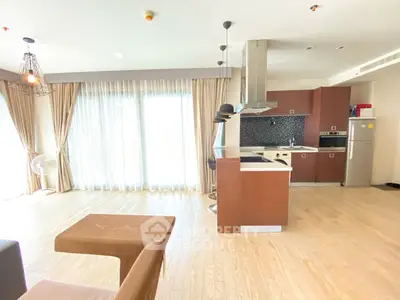 Spacious open-layout kitchen with modern appliances and natural light