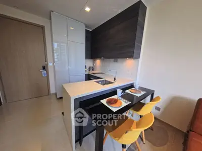 Modern kitchen with sleek design and breakfast bar seating