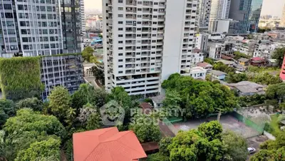 Stunning cityscape view with modern high-rise buildings and lush greenery