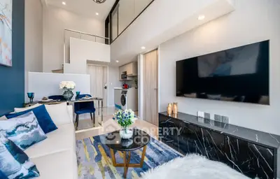 Modern duplex living room with stylish decor and open kitchen layout