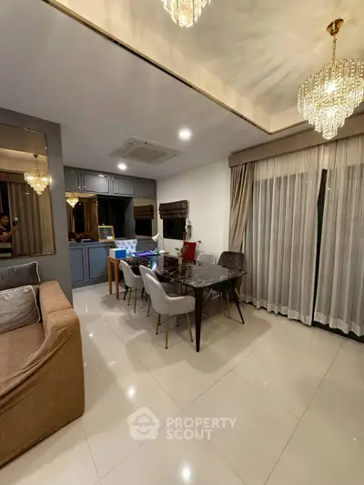 Elegant dining area with chandelier and modern decor in a spacious living room
