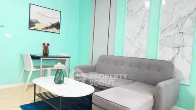 Modern living room with stylish decor and comfortable seating in vibrant colors.