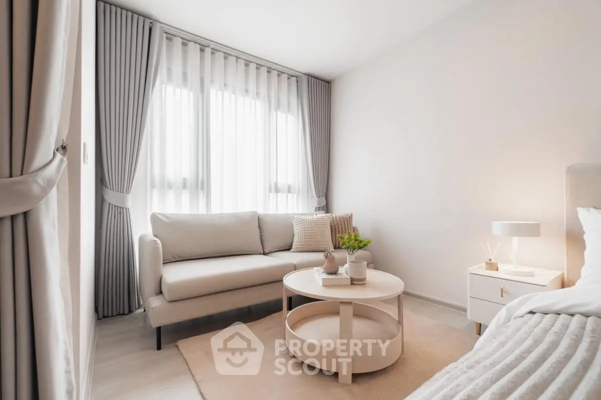 Elegant bedroom with cozy seating area and soft lighting