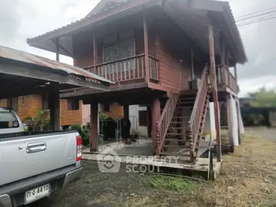 Charming traditional wooden house with elevated design and spacious undercroft area, perfect for tropical living.