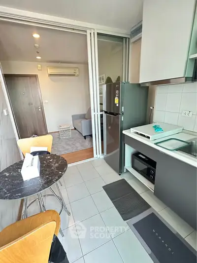 Modern open-layout kitchen with dining area and living room view