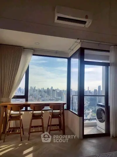 Modern high-rise apartment with stunning city view and in-unit laundry