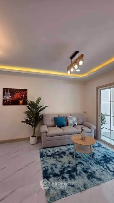 Modern living room with cozy sofa and stylish decor