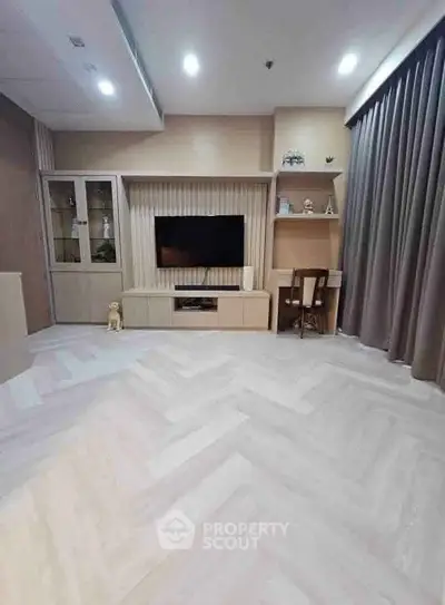 Modern living room with stylish flooring and built-in entertainment center