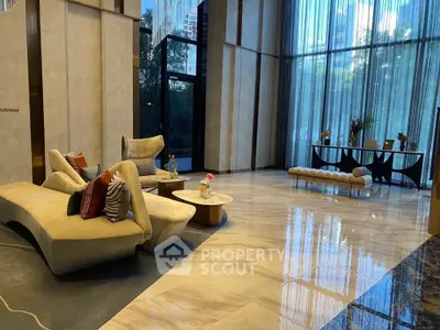 Luxurious modern living room with elegant furniture and floor-to-ceiling windows