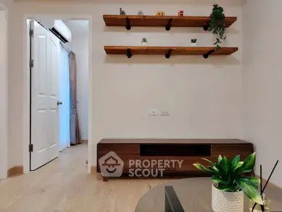 Modern living room with wooden shelves and sleek furniture, perfect for stylish urban living.