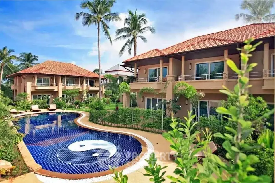 Luxurious tropical villa with stunning pool and lush garden, perfect for serene living.