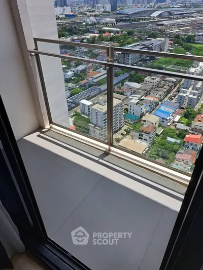 Stunning high-rise balcony with panoramic city view, perfect for urban living.
