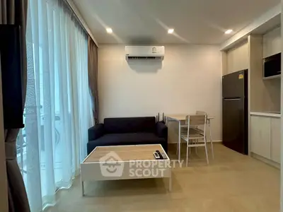 Modern living room with sleek furniture and air conditioning, perfect for urban living.