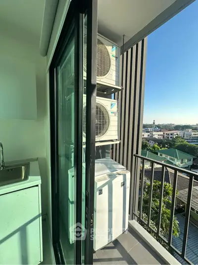 Modern balcony with air conditioning units and city view