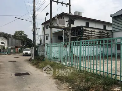 Explore this spacious property with ample parking and potential for renovation in a quiet neighborhood.