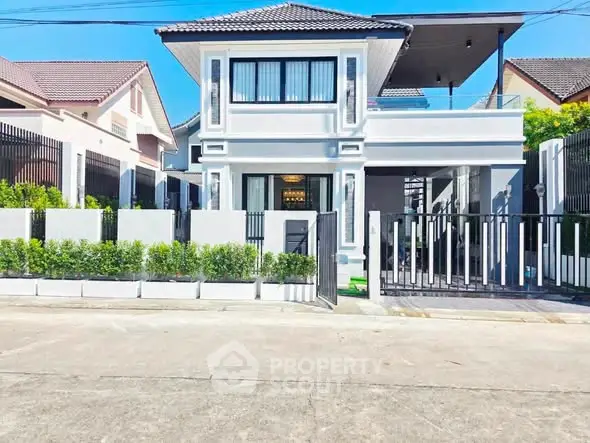 Stunning modern two-story house with sleek design and spacious driveway in a serene neighborhood.