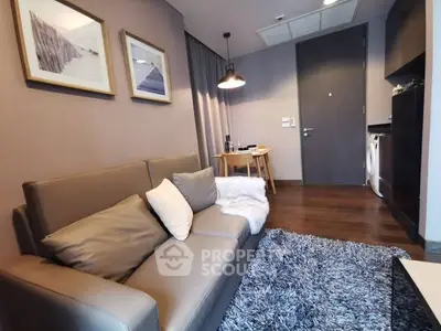 Modern living room with cozy sofa and stylish decor in a contemporary apartment.