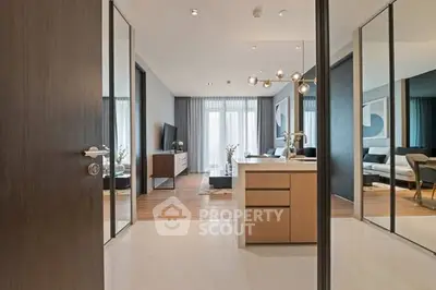 Modern open-plan living room with stylish decor and large windows.