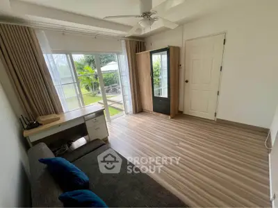 Bright and airy living room with garden view and modern furnishings.