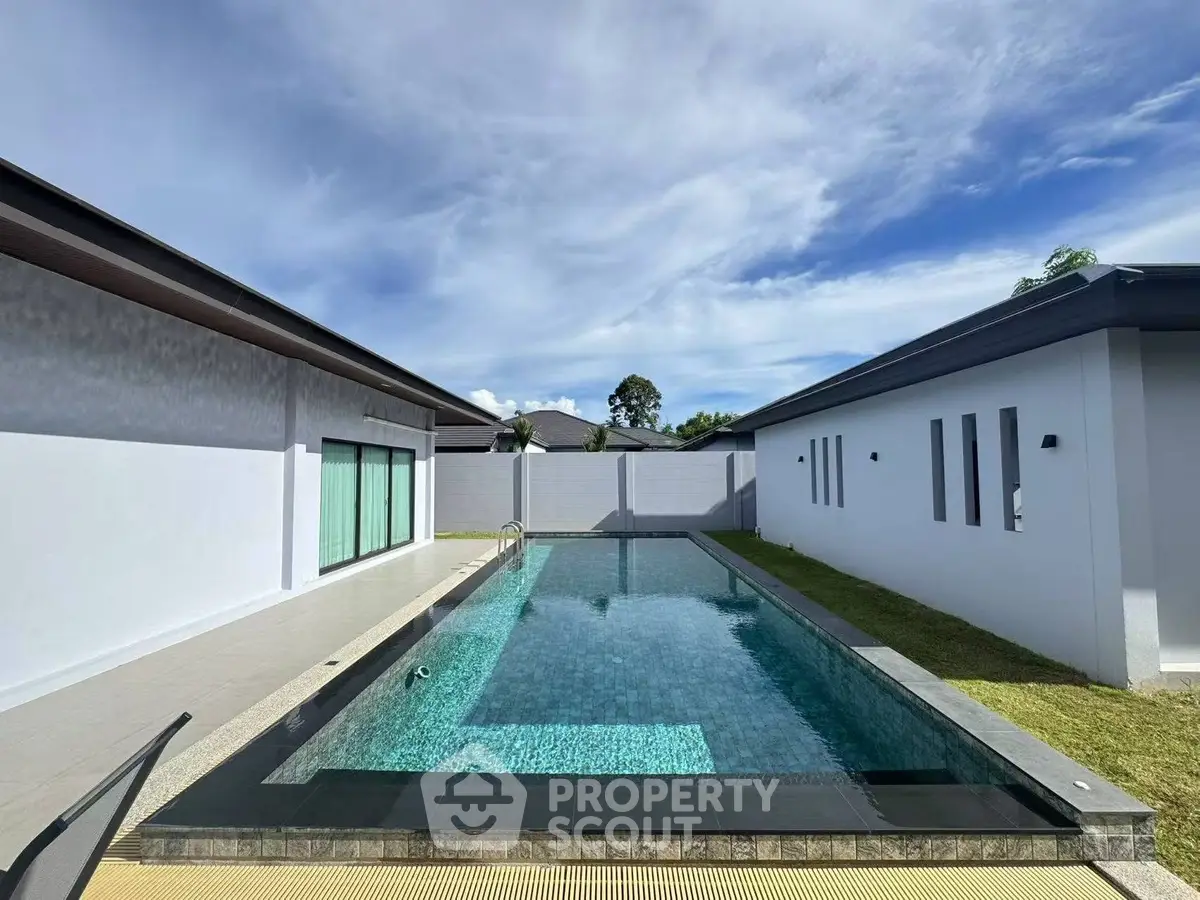 Luxurious modern home with private swimming pool and sleek architectural design.