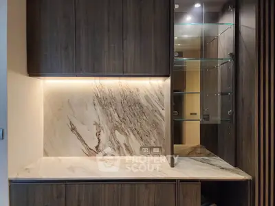 Luxurious kitchen with elegant marble backsplash and modern cabinetry