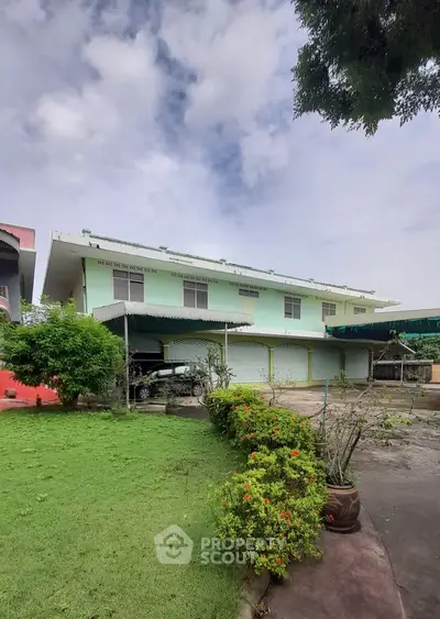 Spacious suburban home with lush garden and ample parking space.