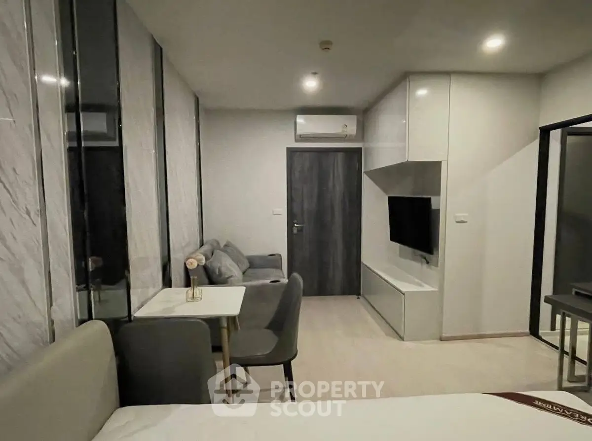 Modern studio apartment with sleek design and cozy living area