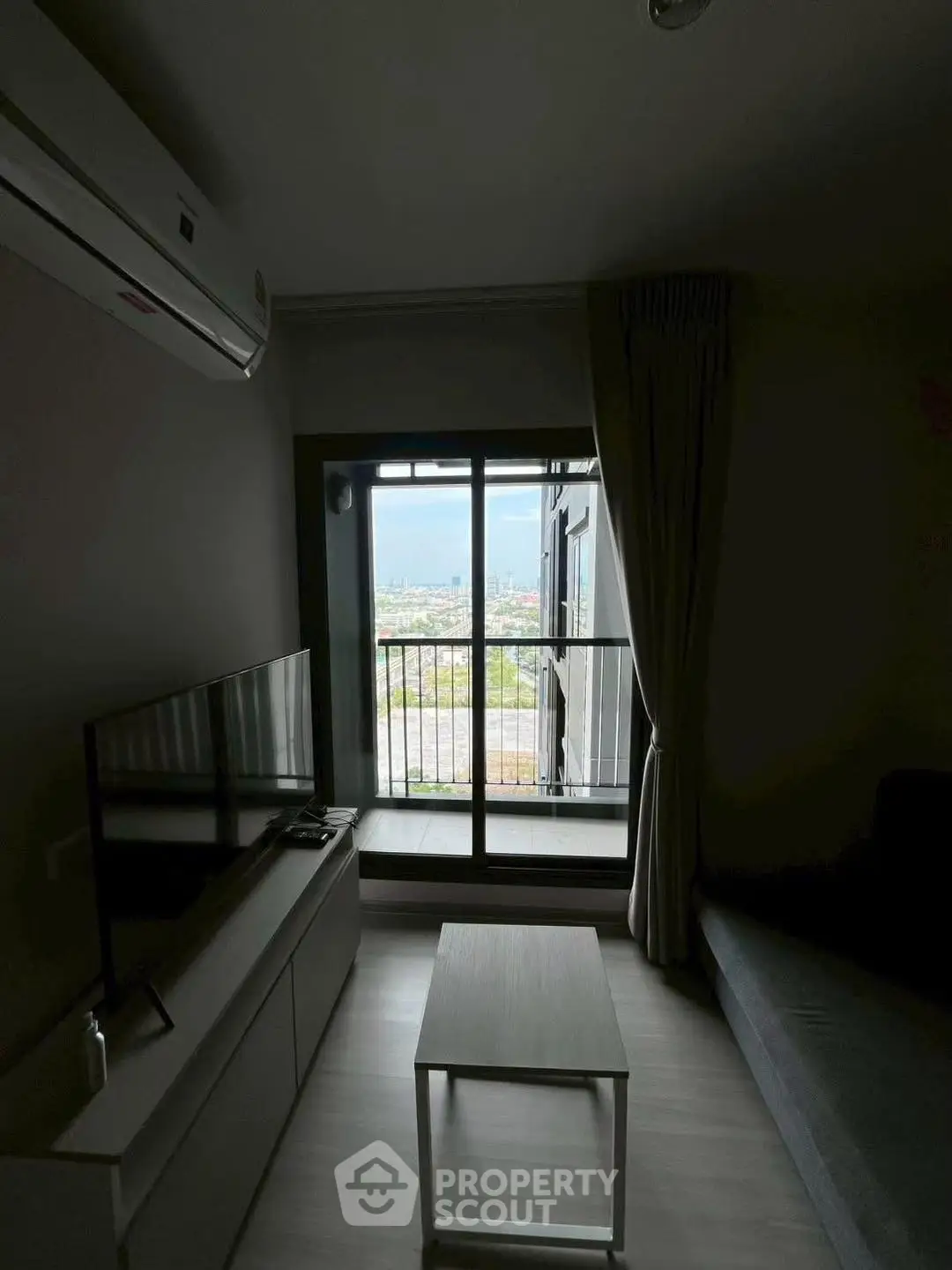 Modern living room with balcony view and sleek furniture