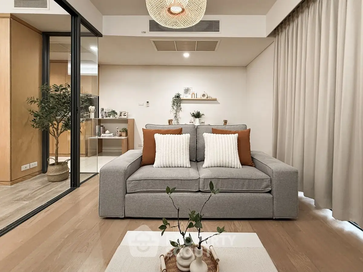 Modern living room with cozy gray sofa and stylish decor