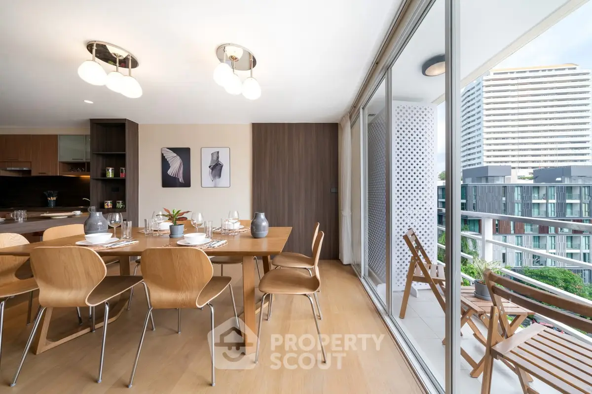 Modern dining area with wooden furniture and balcony view in a stylish apartment