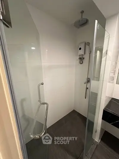 Modern bathroom with sleek glass shower and contemporary fixtures