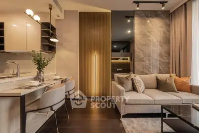 Luxurious modern living room with elegant decor and open kitchen layout, perfect for stylish urban living.