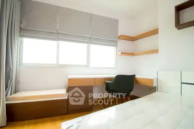 Modern bedroom with study area and natural light