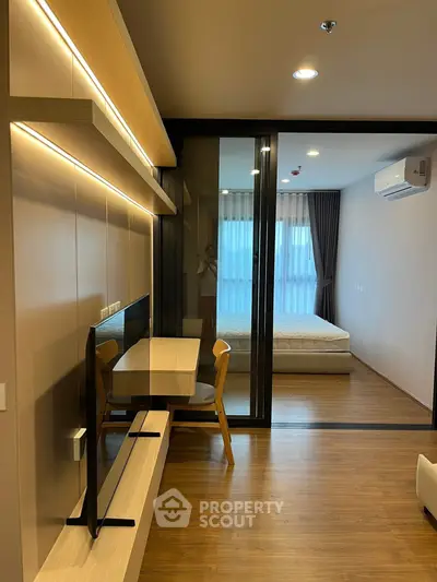 Modern apartment interior with wooden flooring and stylish furniture