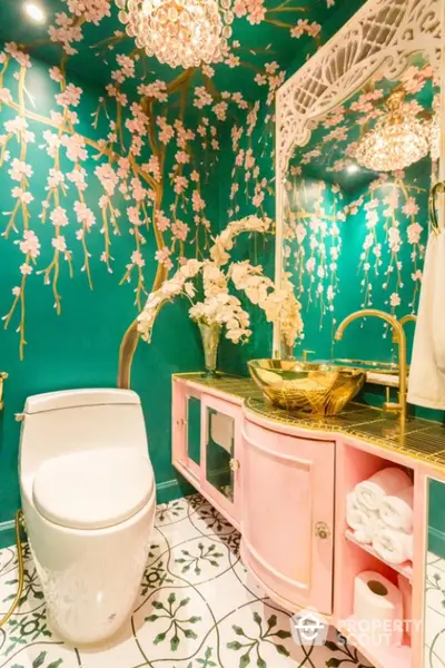 Luxurious bathroom with floral wallpaper and elegant gold fixtures