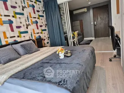 Modern bedroom with stylish decor and cozy ambiance in a contemporary apartment.