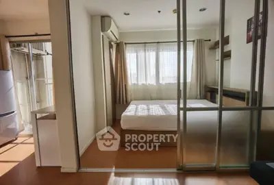 Modern bedroom with sliding glass doors and natural light