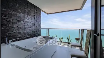 Luxurious balcony with ocean view and modern bathtub