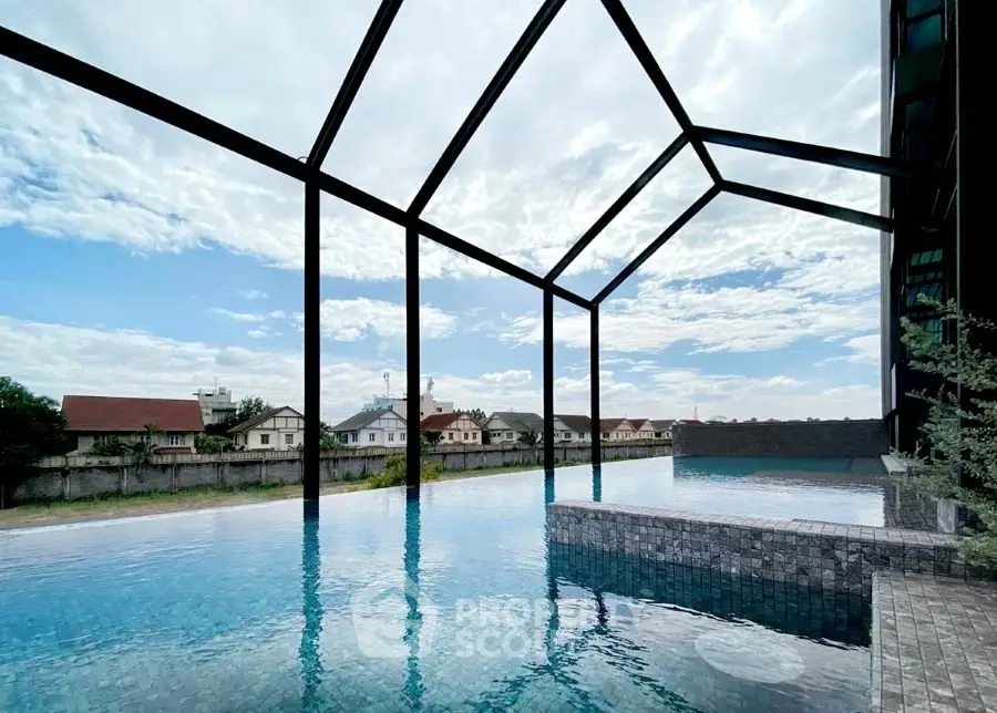Luxurious infinity pool with stunning architectural design and serene views of the surrounding neighborhood.
