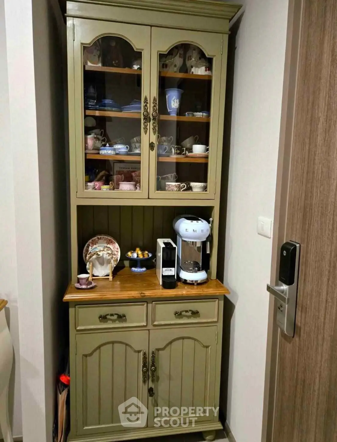 Charming kitchen corner with vintage cabinet and modern coffee maker