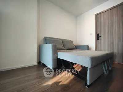 Modern living room with sleek sofa bed and wooden flooring