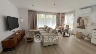 Spacious living room with modern decor and natural light