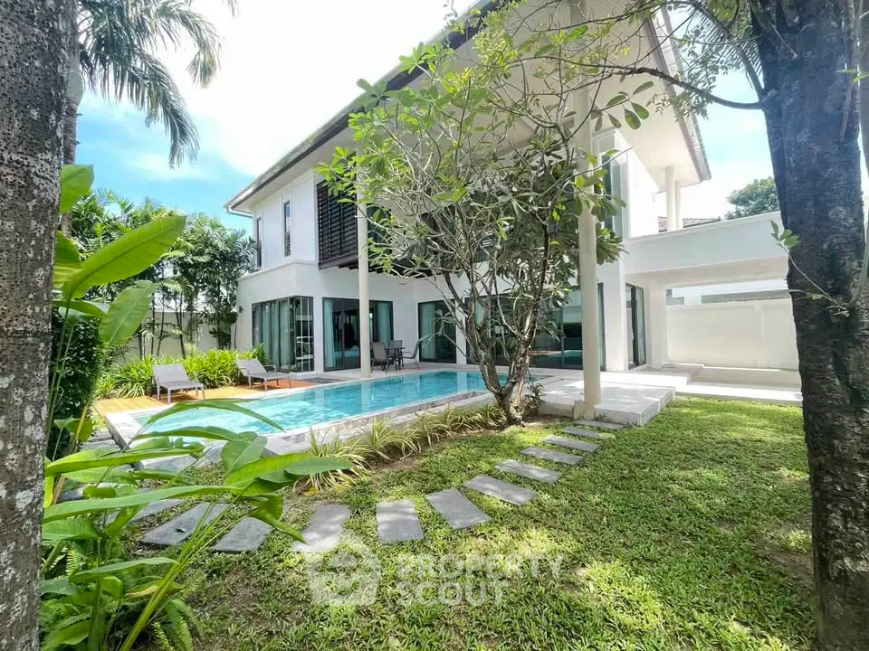 Luxurious modern villa with private pool and lush garden, perfect for serene living.