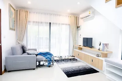 Modern living room with sleek furniture and natural light