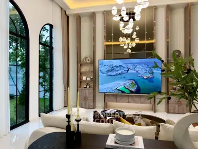 Luxurious living room with high ceilings, large windows, and elegant chandelier, perfect for modern living.